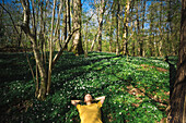 Woman relaxing in forest