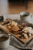 Various biscuits on wooden board
