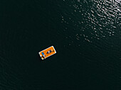 People relaxing on paddleboard