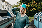 Woman recycling rubbish