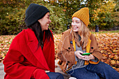 Happy friends in autumn scenery