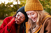 Happy friends in autumn scenery