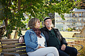 Mature couple relaxing on bench