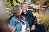 Mature couple relaxing on bench