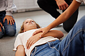 Teacher giving first aid training