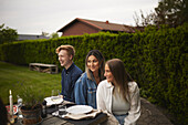 Friends having meal in garden