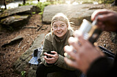 Smiling woman holding cup