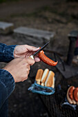 Hands holding sausage