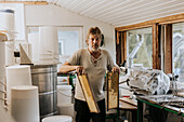 Man holding hive frames