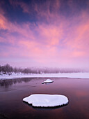 Sunset over winter lake