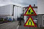 Road signs, building in background