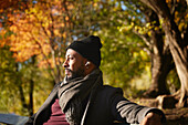 Smiling man sitting on bench