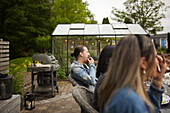 Friends having meal in garden