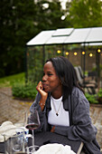 Smiling woman sitting at table