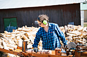 Mature woman working in sawmill