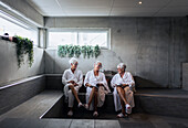 Senior women reading magazines