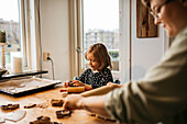 Mother and daughter making cookies