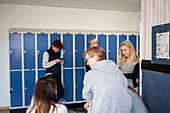 Teenage kids in school locker room