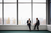 Businessmen sitting in office