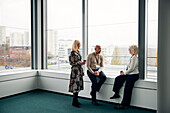 Business people talking during coffee break in office