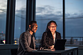 Business people working late in office