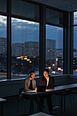 Business people working late in office