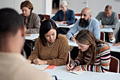 Group of adults sitting in class
