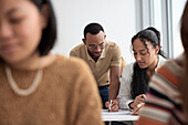 Teacher and adult students in class