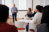 Woman giving presentation at seminar