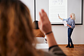 Woman giving presentation at seminar