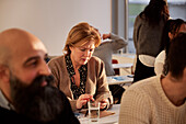 Group of adults sitting in class