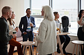 Business people talking during coffee break