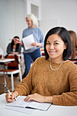 Portrait of smiling woman in class