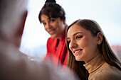 Smiling woman during office meeting