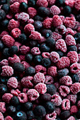 Frozen blueberries and raspberries, full frame