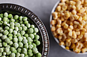 Green peas and corn in bowls