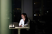 Woman working late in office
