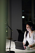 Woman working late in office