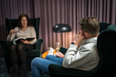 Male patient and female doctor at therapy session