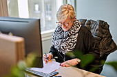 Smiling woman working in office