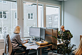 Women sitting at desk in office
