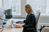 Smiling woman working in office