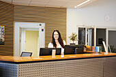 Smiling receptionist looking at camera