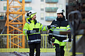 Construction engineers working at construction site