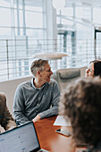 Smiling man at business meeting