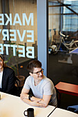 Smiling man at business meeting