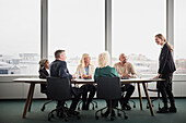Business people having meeting in boardroom