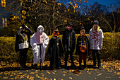 Group of children wearing Halloween costumes