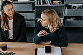 Woman talking during business meeting