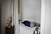 Woman lying in bed at home